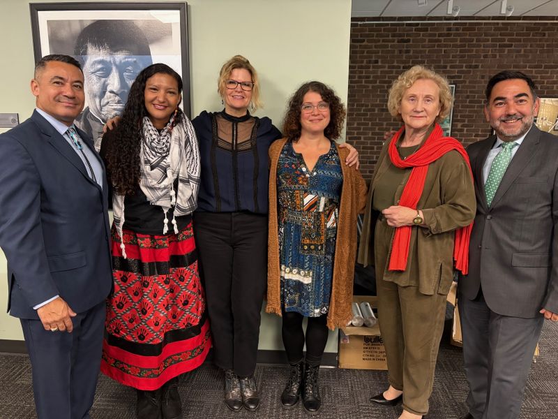 A group of adults pose for a photo at an Indigenous Peoples' Day event at CCBC